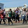 The Snyder High School Band brings Christmas to Downtown Snyder as they march in the Southern Kiowa Chamber Christmas parade Sunday.