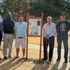 Pictured at the ceremony are - Colonel Michael; Purple Heart recipients: Jerome Jackson, Heath Polm, Gene Williams and Cecil Stockton; and Lou Sims who was instrumental in having the county recognized as a Purple Heart County and getting this sign.